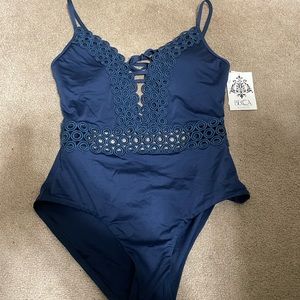 New with tags . Panty liner still attached . Navy blue ! Beautiful suit